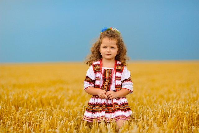 Cute little girl on wheat field